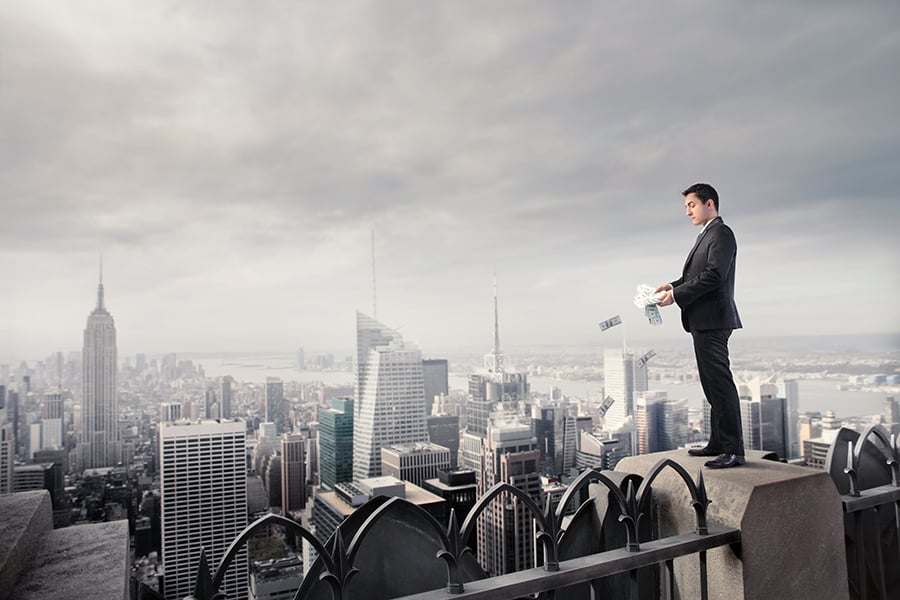 Man overlooking city from a tall building